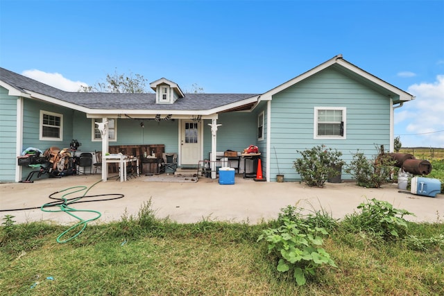 rear view of property with a patio area