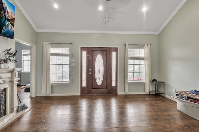 entrance foyer featuring crown molding, dark wood-type flooring, and a chandelier