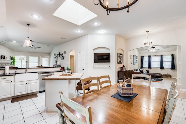 5204 Balsam Dr, Mckinney, TX 75071 - dining area featuring light tile patterned flooring, arched walkways, ceiling fan with notable chandelier, and recessed lighting