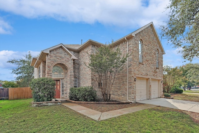 view of front of home with a garage and a front yard