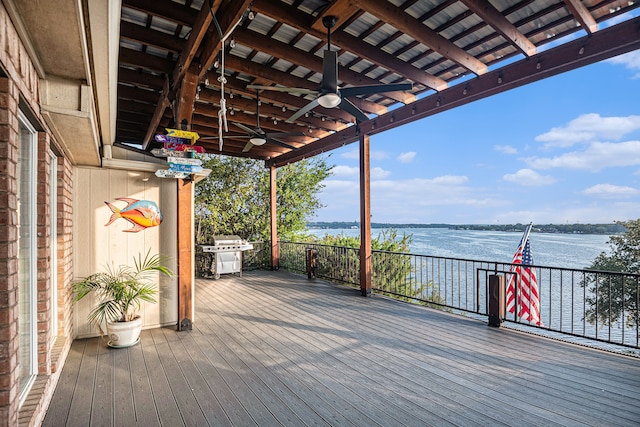 wooden deck featuring a water view, ceiling fan, and area for grilling