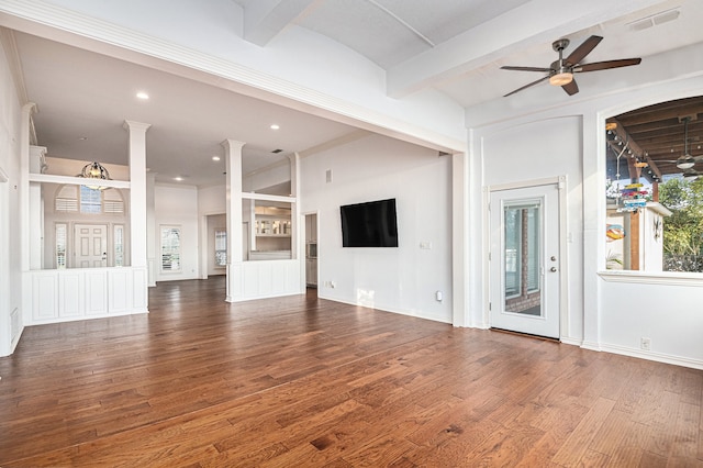 unfurnished living room with decorative columns, beamed ceiling, hardwood / wood-style floors, and ceiling fan