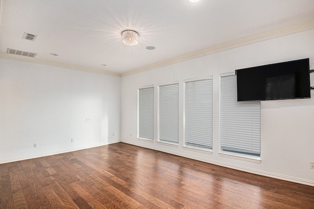 interior space with ornamental molding and hardwood / wood-style flooring