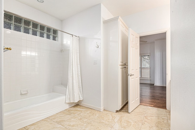 bathroom featuring shower / bath combo with shower curtain and hardwood / wood-style floors