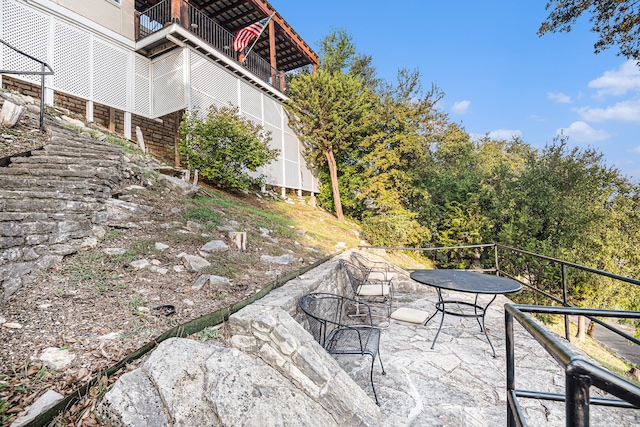 view of patio / terrace with a balcony