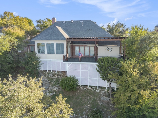 7006 Stone Bluff Ct, Granbury, TX 76048 - back of property featuring a shingled roof, a pergola, and a chimney