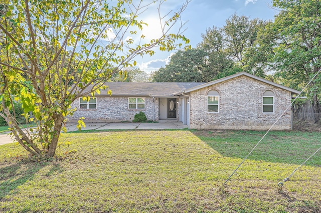 ranch-style house featuring a patio area and a front yard