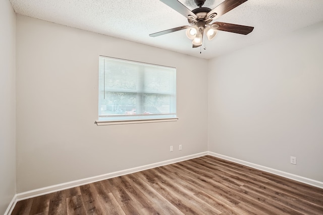 empty room with hardwood / wood-style floors, ceiling fan, and a textured ceiling