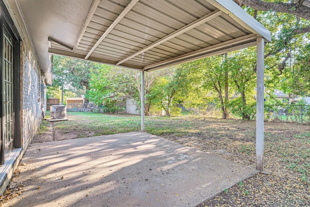 view of patio / terrace with central air condition unit and a fenced backyard