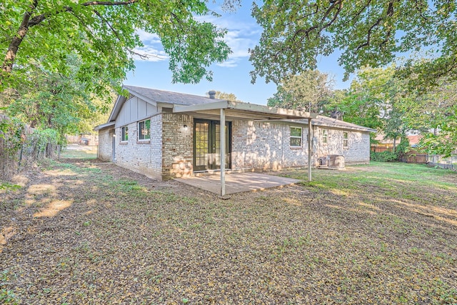 back of house featuring a patio area