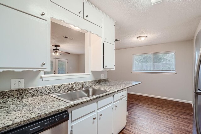 kitchen featuring white cabinetry, sink, dark hardwood / wood-style floors, ceiling fan, and stainless steel dishwasher