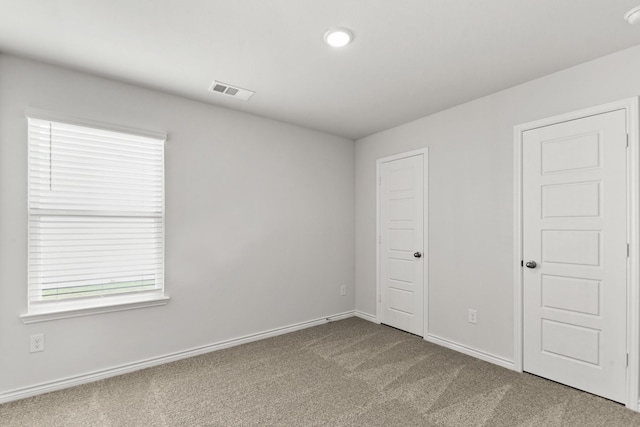 unfurnished bedroom with carpet flooring