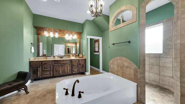 bathroom with vanity, a chandelier, and shower with separate bathtub