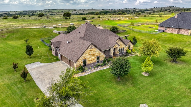 birds eye view of property featuring a rural view