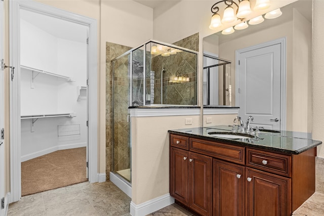 bathroom featuring vanity and an enclosed shower