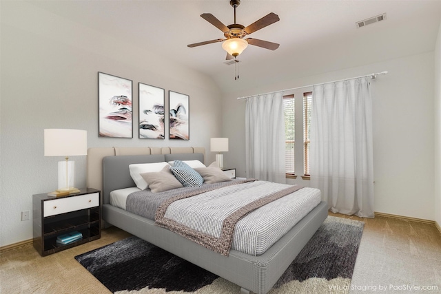 carpeted bedroom with lofted ceiling and ceiling fan