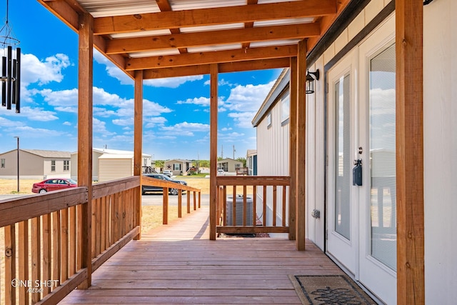 wooden deck featuring french doors