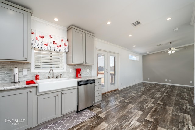 kitchen featuring ornamental molding, stainless steel dishwasher, ceiling fan, and sink