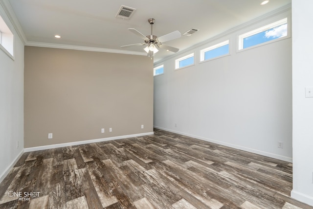 empty room with ceiling fan, ornamental molding, and dark hardwood / wood-style floors