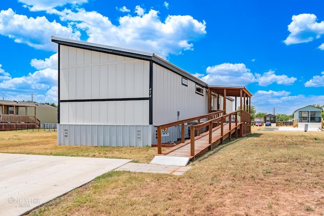 view of home's exterior with a yard