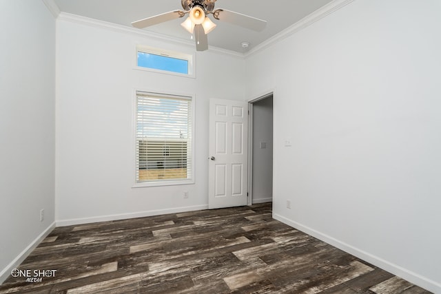 empty room with dark wood-type flooring, ceiling fan, ornamental molding, and a high ceiling