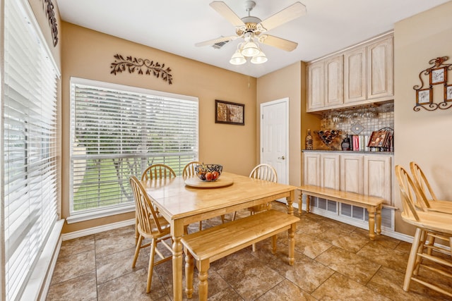 dining space featuring ceiling fan