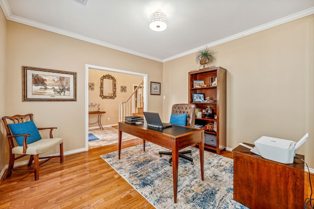 office with crown molding and light wood-type flooring