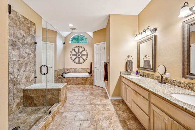 bathroom featuring separate shower and tub and vanity