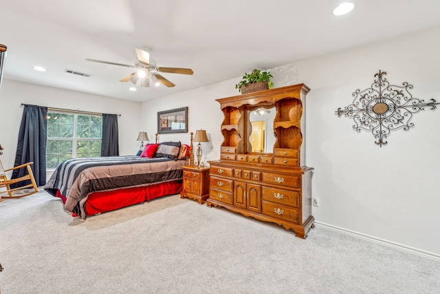 carpeted bedroom featuring ceiling fan