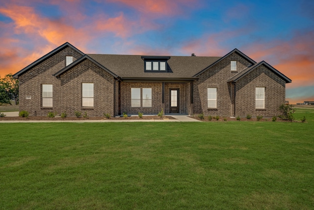 view of front of home with a yard