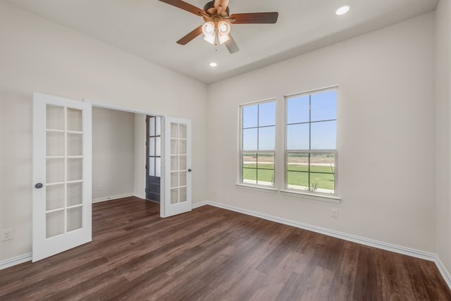 unfurnished room with dark hardwood / wood-style flooring, ceiling fan, and french doors