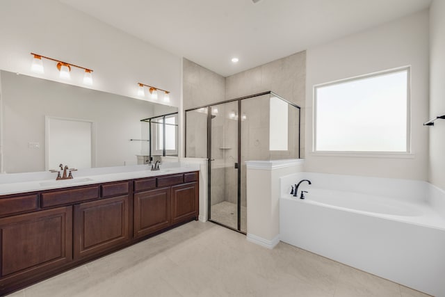 bathroom featuring tile patterned flooring, vanity, and separate shower and tub