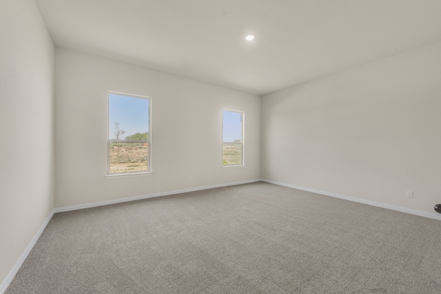 empty room featuring light carpet