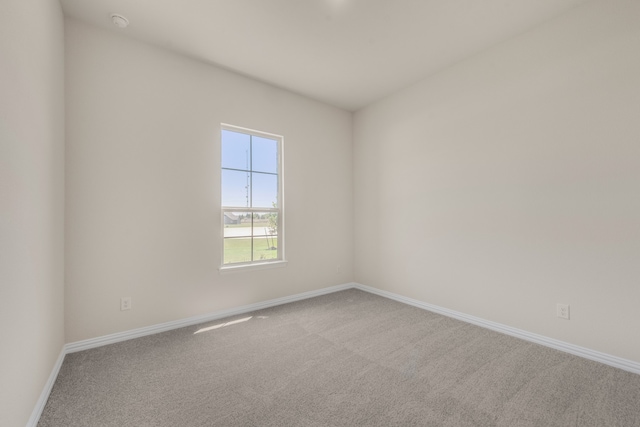 spare room featuring carpet flooring