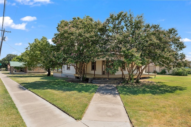 obstructed view of property with a front yard