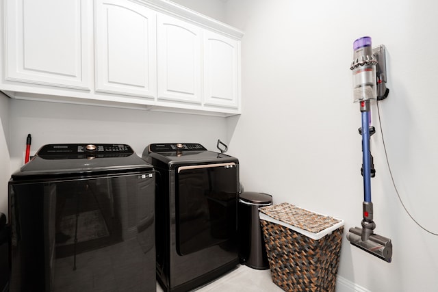 laundry area featuring cabinets and independent washer and dryer