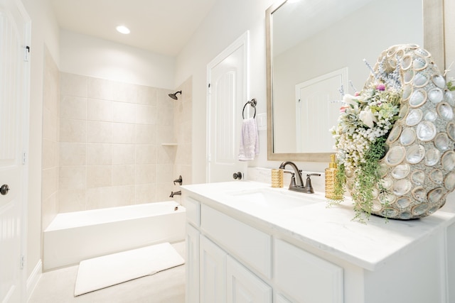 bathroom featuring recessed lighting, vanity, and tub / shower combination