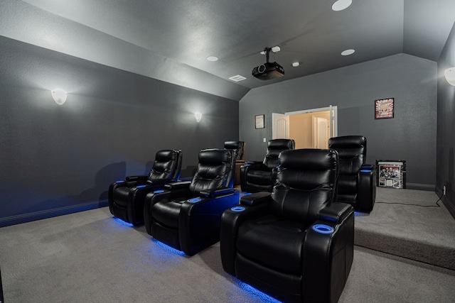 cinema featuring visible vents, baseboards, carpet flooring, and vaulted ceiling