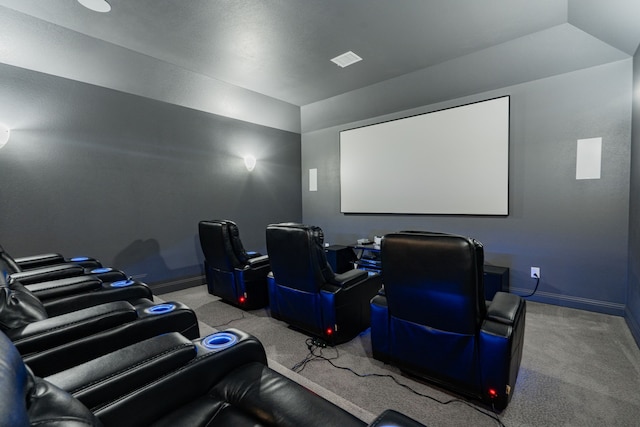 carpeted home theater with lofted ceiling