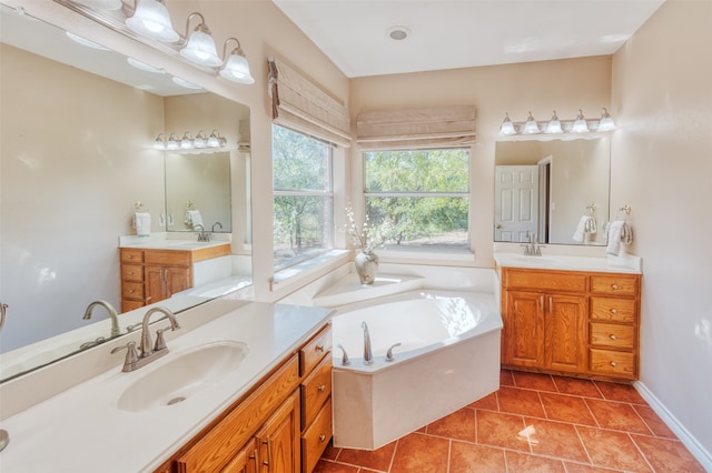 bathroom featuring vanity, a bathtub, and tile patterned floors