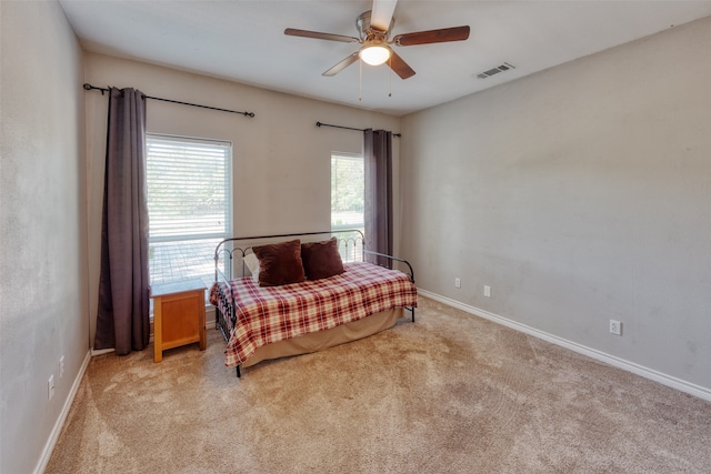 carpeted bedroom with ceiling fan