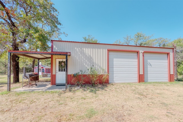 garage featuring a yard