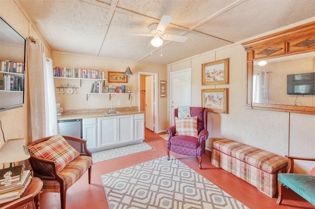 living room with ceiling fan and sink