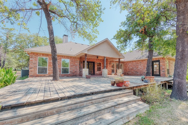 rear view of property with a deck