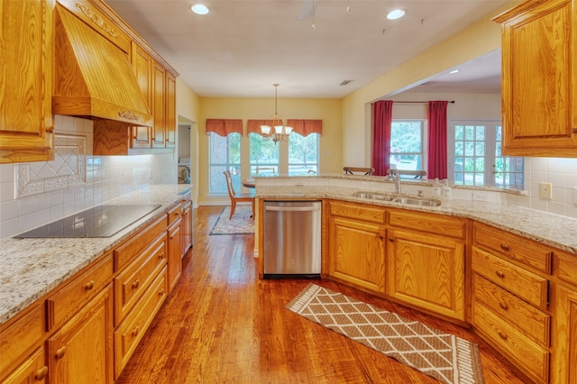 kitchen with custom range hood, black electric cooktop, light hardwood / wood-style floors, stainless steel dishwasher, and sink