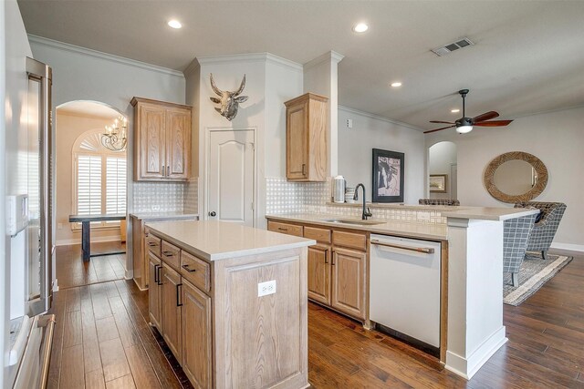 kitchen featuring ceiling fan with notable chandelier, dishwasher, a center island, dark wood-type flooring, and sink