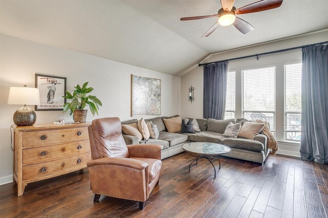 living room featuring ceiling fan, dark hardwood / wood-style flooring, and vaulted ceiling