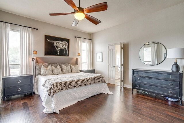 bedroom featuring multiple windows, ceiling fan, and dark hardwood / wood-style floors