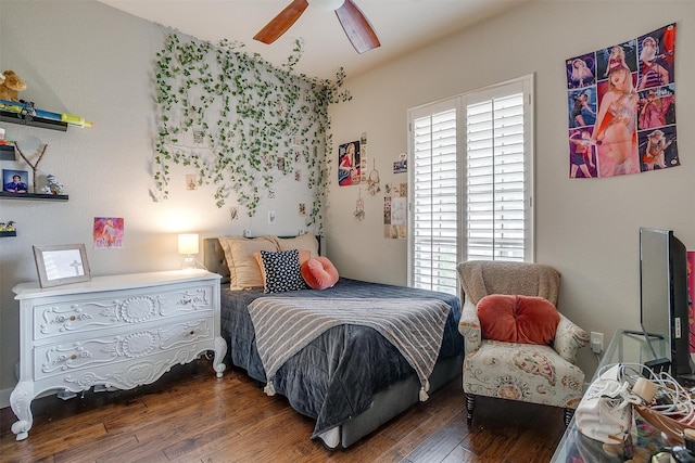 bedroom with dark wood-type flooring and ceiling fan