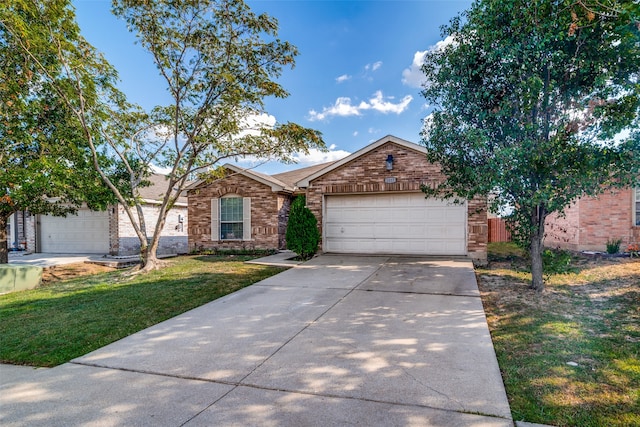 view of front of property featuring a garage and a front yard